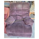 Oversized plush recliner in deep purple fabric.