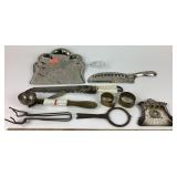 Roll-up metal tape measures, ornate crumb tray