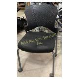 Rolling office chair with a perforated plastic