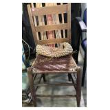 Rustic wooden chair with a ladder-back design a