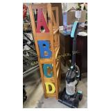 Childrenï¿½s bookcase with painted A,B,C,D along