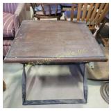 side table with a square wooden top and a metal