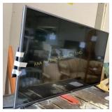 LG 32-inch flat-screen TV,  powers on