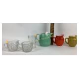 Pitchers,  clear glass  sugar, and creamer set.