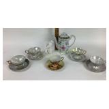 Iridescent tea cups saucers, tea pot, bird