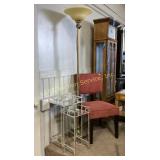 Floor lamp with a brass finish and frosted glass