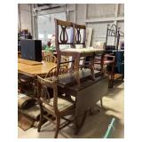 Dining set with a dark wood drop-leaf table and