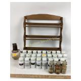 Wooden spice rack with milk glass spice jars.