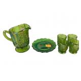 Carnival glass pitcher, shot glasses and