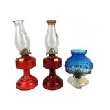 Oil lamps red painted, and clear bottom blue top.