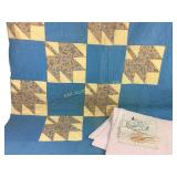 Embroidered days of the week squares, blue quilt,