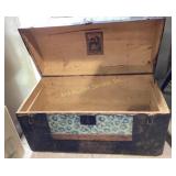 Steamer trunk with decorative hardware and