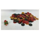 Possible Bakelite game chips and dice.