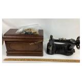 Sewing machine. With wooden cover top and