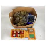 Votive glass candle holders, dirty.