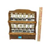 Spice jar rack with labelled jars and lids, good