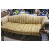 Curved arm sofa, needs cleaned, some tearing