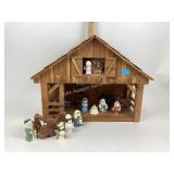 Nativity set handpainted with wooden stable.