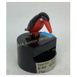 Plastic bird toothpick dispenser.