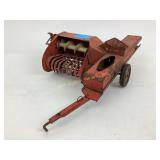 Pressed steel hay baler