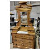 Carved wooden dresser with swivel mirror and