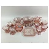 Pink depression glass including drinks glasses,