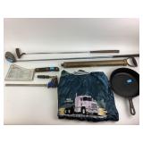 Cast iron skillet, fumigator, two golf clubs,