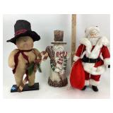 Christmas Snowman and Santa figurines.