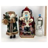 Christmas Snowman and Santa figurines.