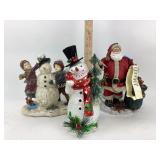 Christmas Snowman and Santa figurines.