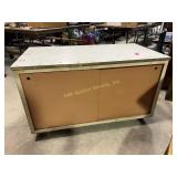 Rolling metal cabinet with sliding doors and