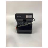 Polaroid one step flash camera
