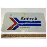 Amtrak railway sign, some rust and stains