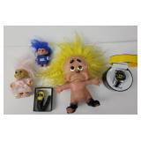 Troll dolls, Batman watches, one with case.