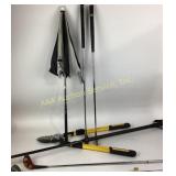 Yardworks lopper.  Golf clubs.  Golf umbrella.
