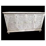 White cabinet with carved panel doors