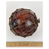 Antique amber glass fish net ball, 6-inch diameter