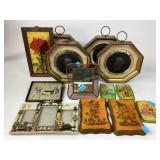Collection of decorative frames, plaques, and cand