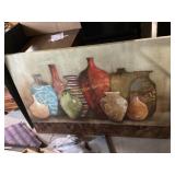 Framed artwork featuring colorful vases