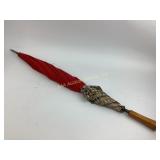 Burberry umbrella with red canopy and plaid accent