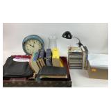 Books, CDs, Clock, Lamp, Papers