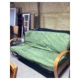 Wood and metal futon with green cushion