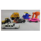 Toy vehicles: helicopter, school bus, tractor, lim
