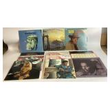 12 vinyl records with worn covers