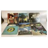 12 Vinyl Records with Worn Covers