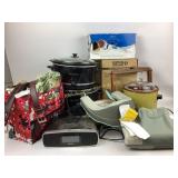 Crock pots, massagers, thirty-one bag, slippers, I