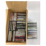 Assortment of music CDs and cases
