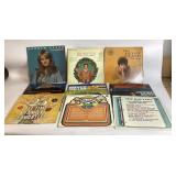 12 Vinyl Records with Worn Covers