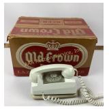 White rotary telephone with Old Crown box