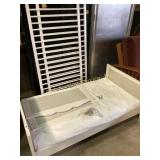 White wooden crib or toddler bed frame